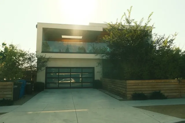 Local concrete driveway contractor Jacksonville FL — licensed crew compacting base layer and placing rebar reinforcement for new concrete driveway installation in Duval County